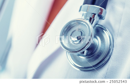 Doctor holding a stethoscope listening heartbeat Doctor holding a stethoscope listening heartbeat 25052543