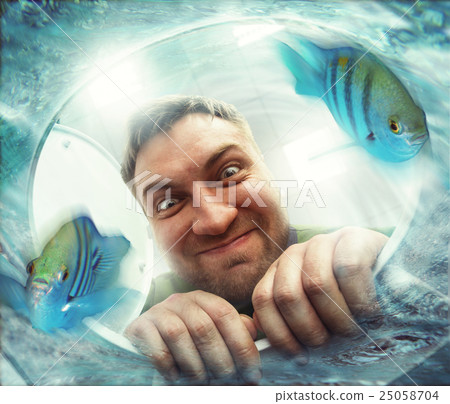 Man looking in the toilet bowl 25058704