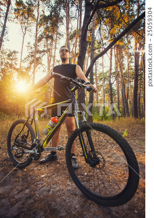 Cyclist Riding the Bike on a Trail in Summer 25059304