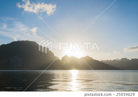 Sun rise behind mountain at Khao Sok National Park 25059829