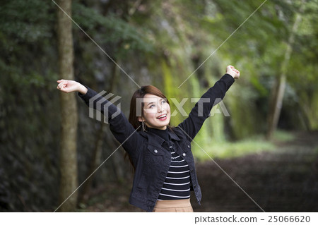 A young woman with a smile growing at a hiking course of Hyogo ken Takedao waste line 25066620
