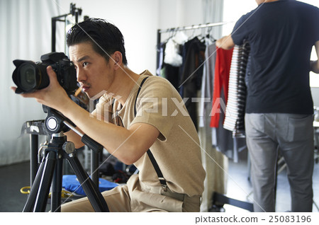 Photographer at shooting site Photographer at shooting site 25083196