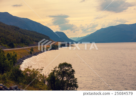 Fjord, rocky beach at sunset, Norway 25084579