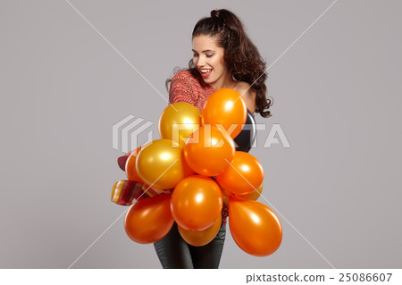 Young pretty woman with colored balloons Young pretty woman with colored balloons 25086607
