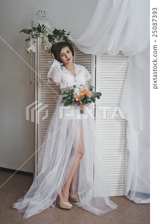 Studio portrait of a girl in a translucent Studio portrait of a girl in a translucent 25087393