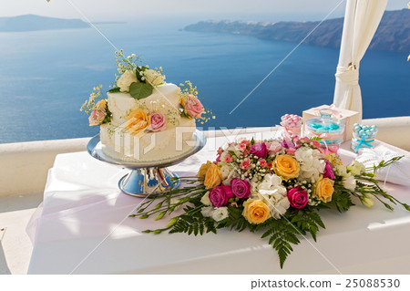 Wedding cake and bouquets of flowers on the table 25088530
