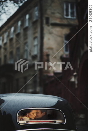 young and beautiful couple sitting in the cortege young and beautiful couple sitting in the cortege 25089502