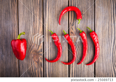 Red hot chili and Bell peppers on wood background 25089713