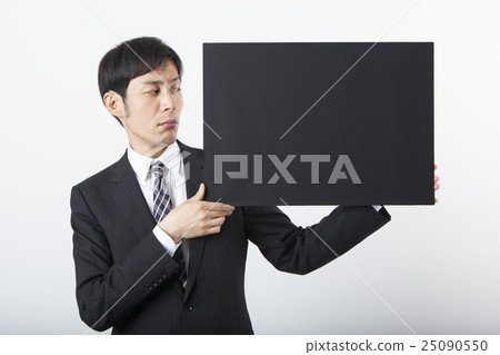 A businessman with a blackboard 25090550