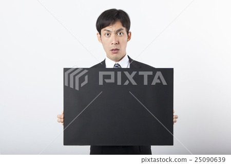 A businessman with a blackboard A businessman with a blackboard 25090639