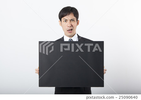 A businessman with a blackboard A businessman with a blackboard 25090640