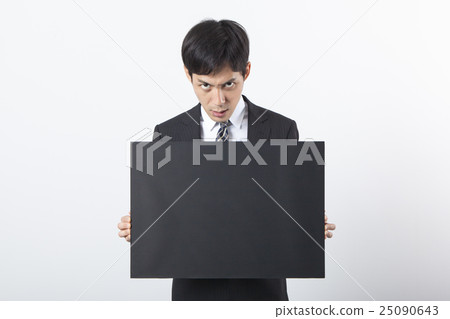 A businessman with a blackboard 25090643