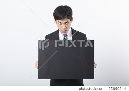 A businessman with a blackboard 25090644