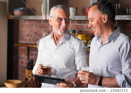 Two gentlemen having a little party with alcohol Two gentlemen having a little party with alcohol 25092253