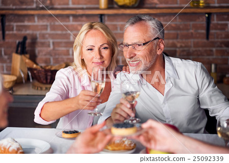 While heterosexual couple tasting wine at While heterosexual couple tasting wine at 25092339