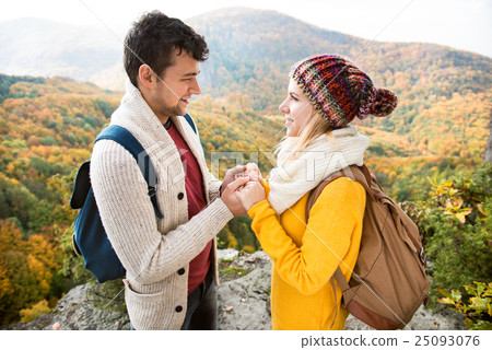 Beautiful couple in autumn nature against colorful Beautiful couple in autumn nature against colorful 25093076