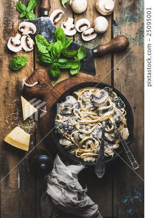 Mushroom pasta spaghetti in iron pan served with 25095001