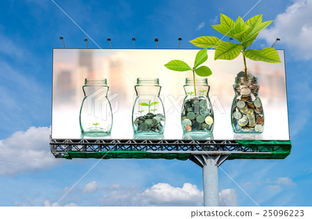 Billboard on beautiful sky showing the mix coins and seed in clear bottle on on cityscape photo blurred cityscape background for advertisement, Business investment growth concept 25096223