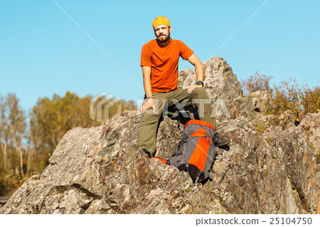 Young male with beard is traveling through the Young male with beard is traveling through the 25104750