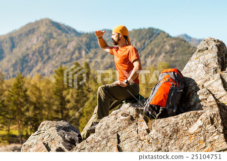 Young male with beard is traveling through the Young male with beard is traveling through the 25104751