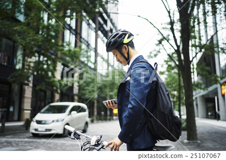 Businessman cycling 25107067