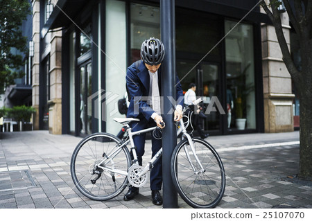 Businessman cycling 25107070