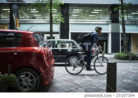 Businessman cycling Businessman cycling 25107164