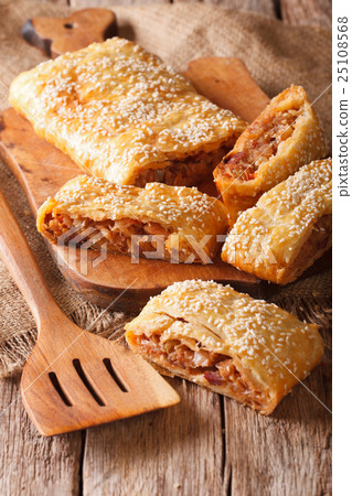 sliced pie stuffed with cabbage and sausages sliced pie stuffed with cabbage and sausages 25108568