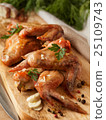 Grilled chicken wings on board. Food concept 25109743