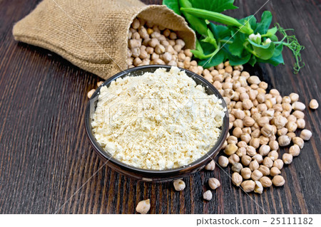 Flour chickpeas in bowl with peas on board Flour chickpeas in bowl with peas on board 25111182