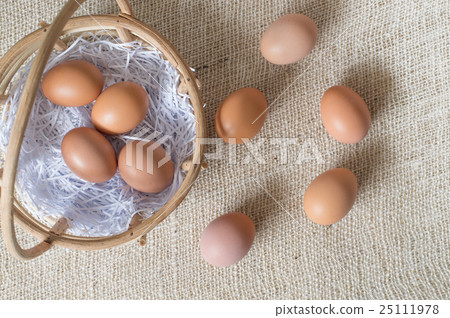 Eggs in bamboo basket on jute sack Eggs in bamboo basket on jute sack 25111978