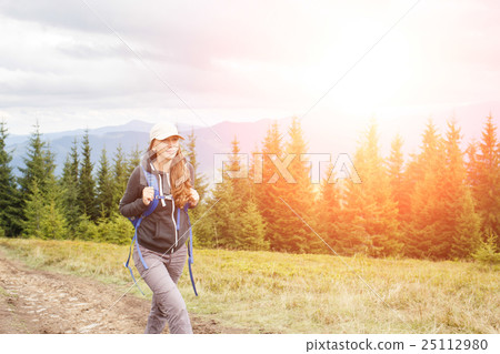 Young backpacker woman enjoying mountain trip Young backpacker woman enjoying mountain trip 25112980