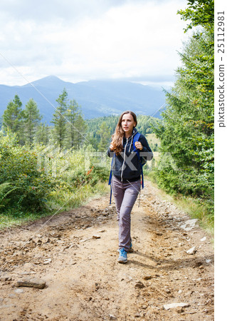 Young backpacker woman enjoying mountain trip Young backpacker woman enjoying mountain trip 25112981