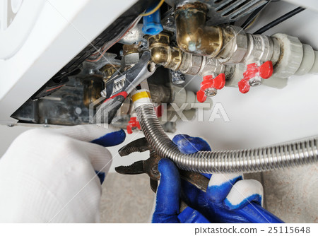 Plumber attaching to pipe gas boiler. Plumber attaching to pipe gas boiler. 25115648