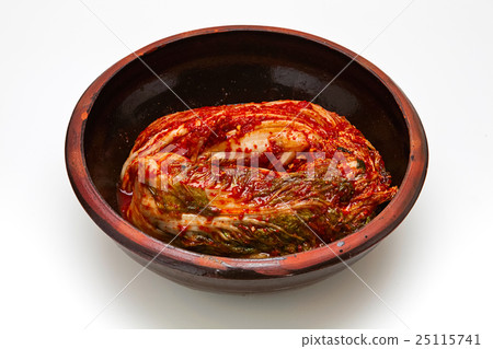 Kimchi in a crock head isolated on white backgroun 25115741