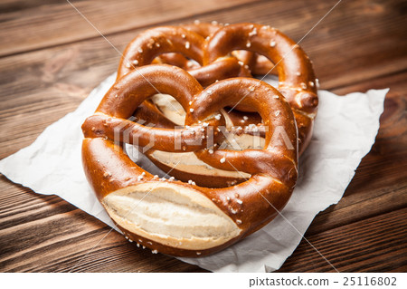 Pretzels on wooden table Pretzels on wooden table 25116802