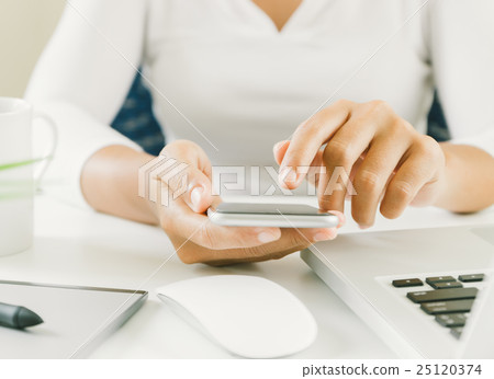 close up woman hand use finger touching on phone 25120374