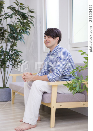 Men sitting on the sofa Men sitting on the sofa 25133432