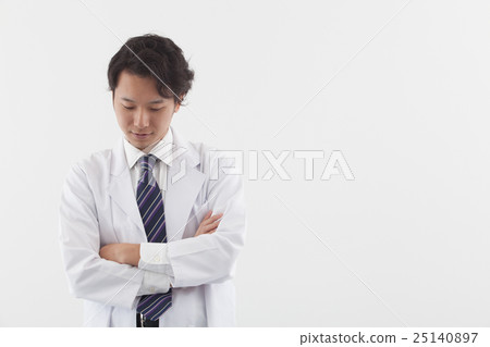A young doctor who thinks about a patient 25140897