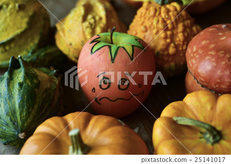 apple disguised as a pumpkin between some pumpkins 25141017
