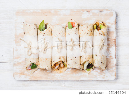 Tortilla wraps with various fillings on shabby Tortilla wraps with various fillings on shabby 25144304