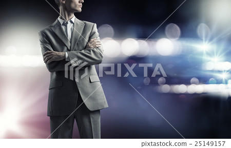 Confident businessman in bokeh lights 25149157