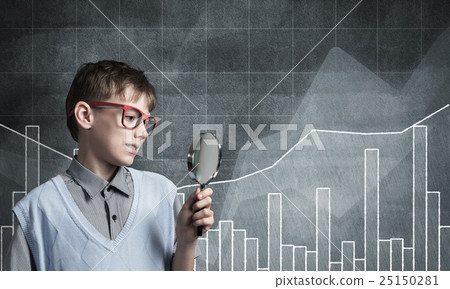 Curious school boy with magnifier 25150281