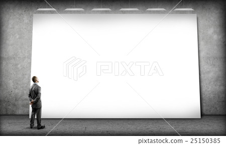 Businessman and big billboard 25150385