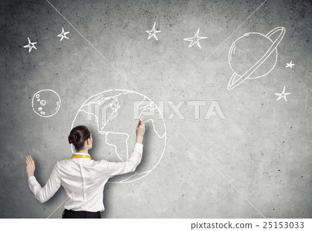 Rear view of businesswoman presenting drawn planet 25153033