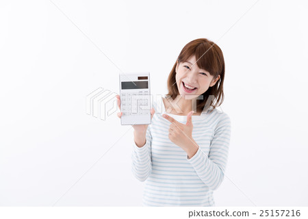 A young woman pointing at a computer A young woman pointing at a computer 25157216