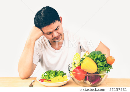 A man seriously dislike fresh vegetables 25157381