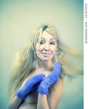 The young woman in bright mittens with retro effec The young woman in bright mittens with retro effec 25161433