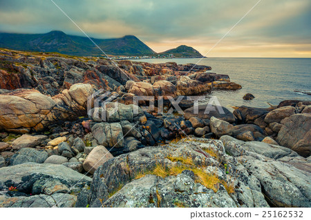 Senja island at sunset. Wilde rocky beach 25162532