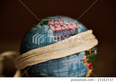terrestrial globe with piece of cloth tied around terrestrial globe with piece of cloth tied around 25162537
